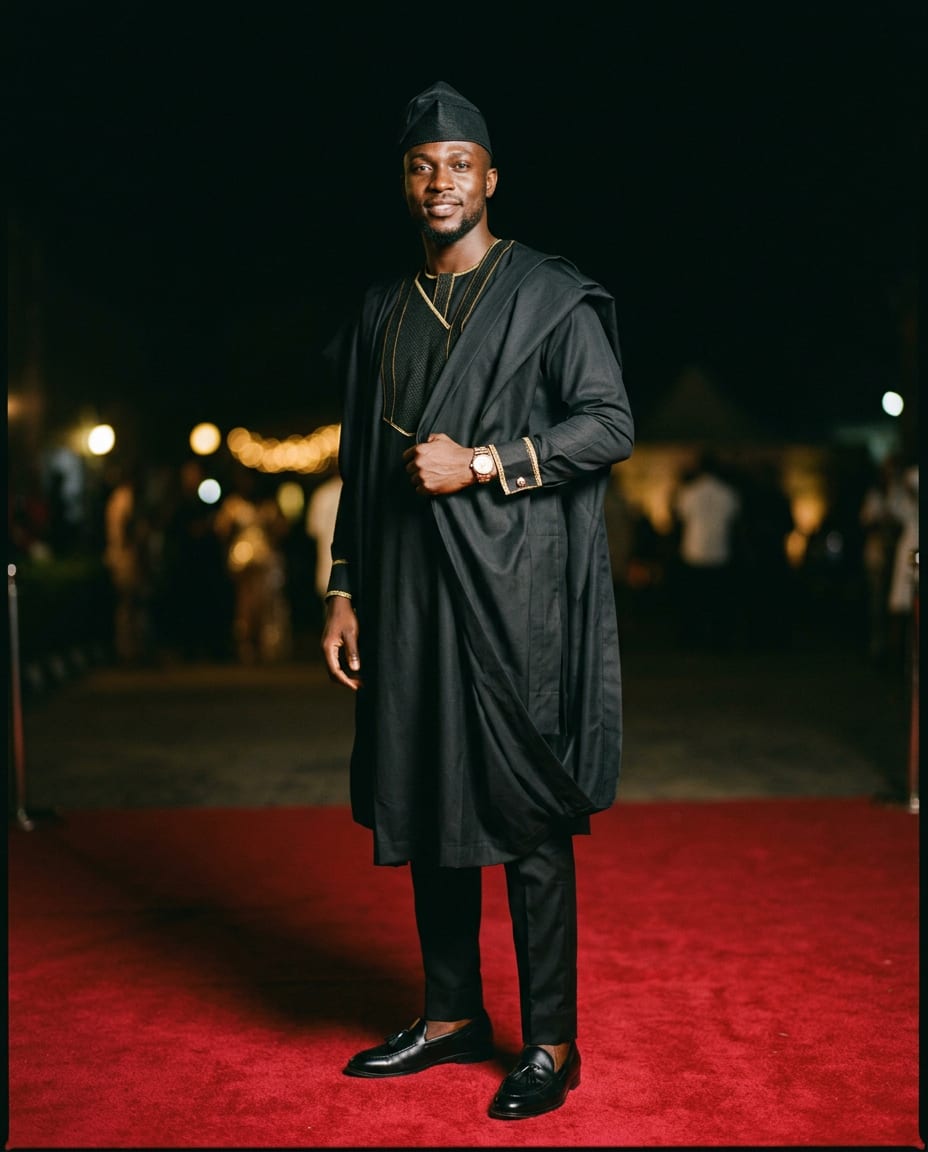 Black agbada with gold embroidery and fila