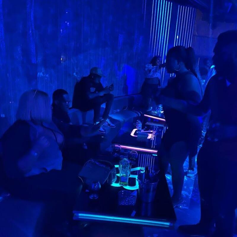 The room, lit blue
